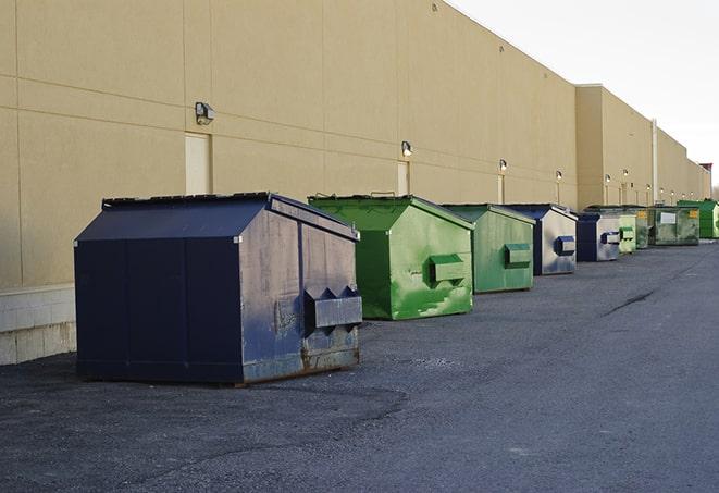 a large dumpster awaits materials from a renovation project in Barneveld